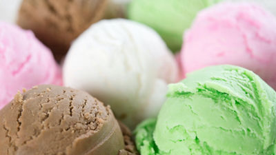 Scoops of ice cream, chocolate, vanilla and strawberries